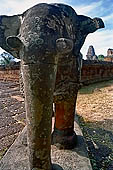 Angkor - Eastern Mebon - monolithic elephants at the corners of the platforms of the pyramid